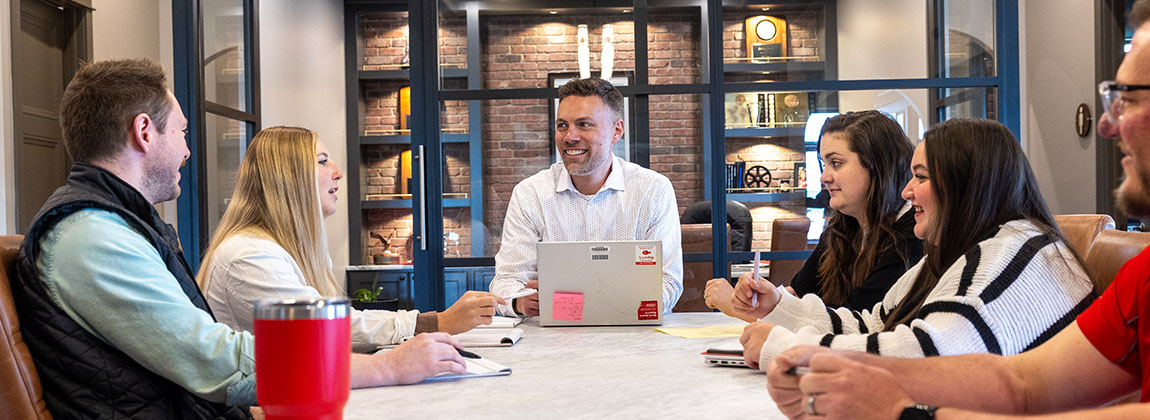 A group of people gathered around a table